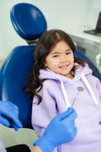 Young girl in dentist’s chair