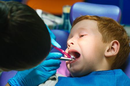 young child visiting dentist for root canal 